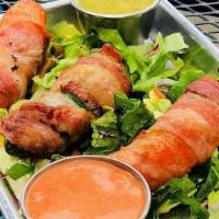 Jalapeños Poppers · Three fresh seedless jalapeño peppers filled with cream cheese, wrapped with bacon and deep ...