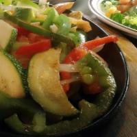 Vegetarian Fajitas · Combination of grilled bell peppers, mushrooms, tomatoes, zucchini, nopalitos, squash, and o...