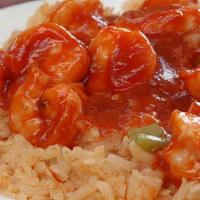 Camarones A La Diabla · 14 medium sized shrimp cooked in a medium diablo sauce. Served over a bed of rice.