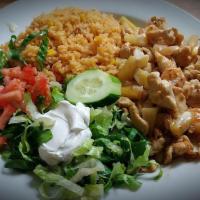 Cancun Chicken · Grilled chicken strips, shrimp, and pineapple topped with melted cheese. Served with rice, r...