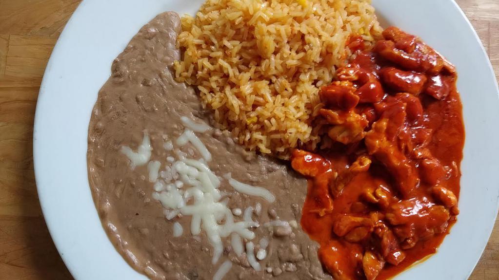 Pollo Chipotle · Strips of grilled chicken cooked with our special chipotle sauce. Served with rice, black or refried beans, and tortillas.