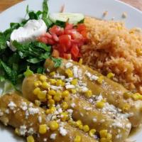 Enchiladas Suiza · Three chicken enchiladas topped with green sauce, queso fresco, and corn. Served with rice, ...