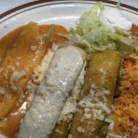 Tres Marias · One chicken, one beef, and one cheese enchilada covered with three different sauces, red, qu...