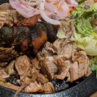 Carnitas · Pork tips served with rice, black or refried beans, romaine mix, guacamole, a jalapeño poppe...