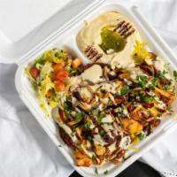 Shawarma Dinner · Fresh hot sliced lamb and beef or chicken combined with spices, tahini sauce, onions and sum...