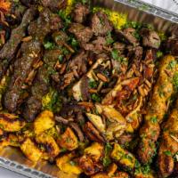 Holyland Combo · A mixture of shish kabob, shish tawook and shawarma served with hummus, baba ghanouj, salad ...