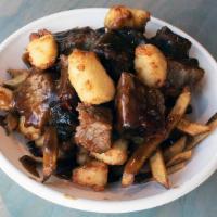 Urban Poutine · French fries topped with breaded cheese curds & brown gravy. topped with pulled pork or burn...