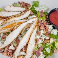Chef Salad · Topped with smoked turkey, diced ham, tomato, red onion, cucumber, strips of provolone and A...