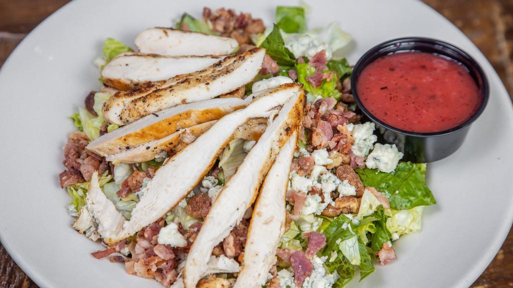 Chef Salad · Topped with smoked turkey, diced ham, tomato, red onion, cucumber, strips of provolone and American cheese.