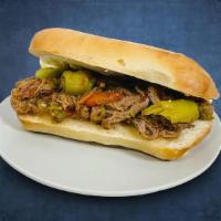 Italian Beef - Vito Corleone · Thin slices of roast beef simmered and served into fresh Italian bread.