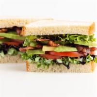 Avocado Blt Sandwich · Crispy bacon, lettuce, tomato, sliced avocado, and pesto spread. Served on your choice of wh...