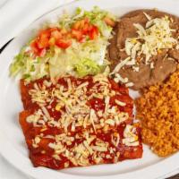 Enchilada Plate · Three rolled tortillas dipped in red mole sauce, stuffed with your choice of meat  topped wi...