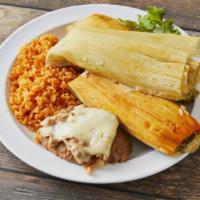 Tamale Plate · Three home-made tamales served with rice, beans and sour cream.