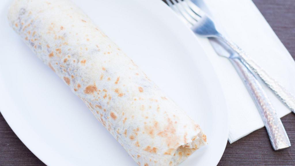 King Burrito Plate · A large flour tortilla filled with beans, lettuce, tomato, sour cream and cheese served with rice, beans and your choice of meat.