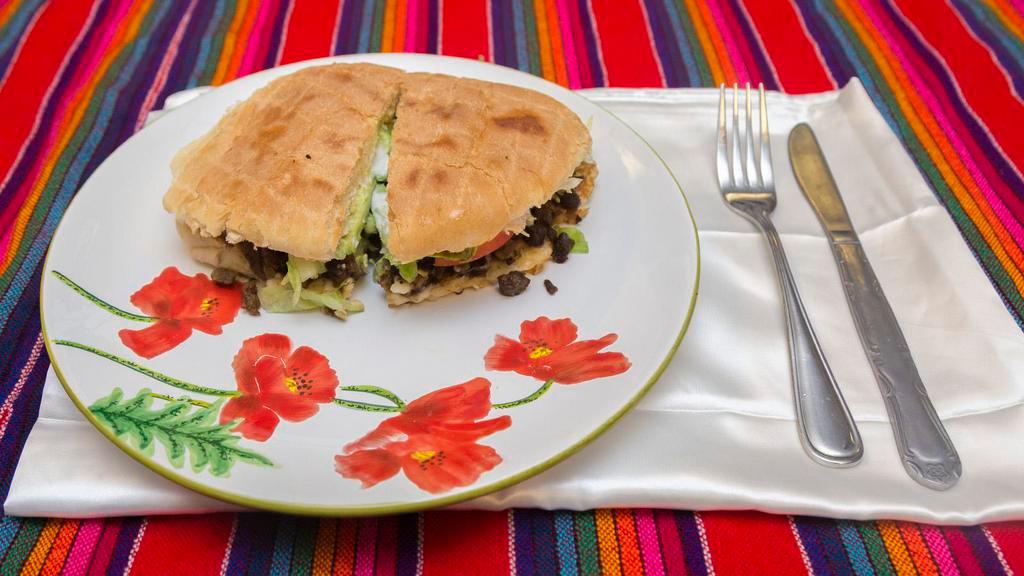 Vegetarian Torta · Served with beans rice cheese lettuce tomato avocado and sour cream
