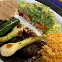 Tampiqueña · Served with rice beans 1 enchilada grilled pepper grilled onions and guacamole