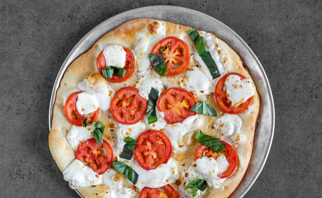 Margherita · Regular. Our traditional crust lightly brushed with chopped garlic and extra-virgin olive oil, topped with sliced fresh whole mozzarella cheese, Roma tomatoes, and fresh basil. DOES NOT HAVE RED SAUCE