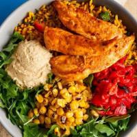 Peri-Peri Chicken Tender Bowl · Portuguese rice topped with PERi-PERi chicken, arugula, roasted red peppers, cut grilled cor...