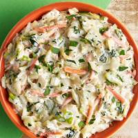 Coleslaw · House-made crunchy slaw with onion and carrots in a creamy mayo dressing.