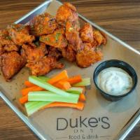 Full Order Duke'S Boneless Wings · Buttermilk fried chicken tossed in one. of our signature sauces. served with. ranch or bleu ...