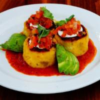 Tamale Cakes · Salsa roja, pico de gallo, cilantro,. sour cream, avocado