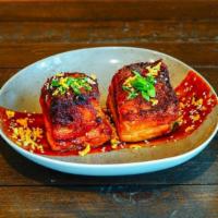 Korean Pork Belly · Crispy and glazed pork belly, Korean bbq,            fish sauce, puffed rice