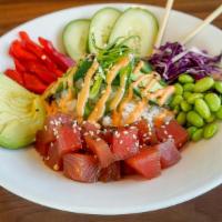 Volcano Poke Bowl · Tamari ginger sushi-grade ahi tuna,. avocado, bell peppers, cucumbers, red cabbage, edamame,...