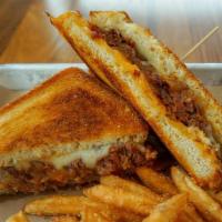 Brisket Grilled Cheese · Smoked brisket, caramelized onions, guava BBQ, cheddar cheese, and provolone