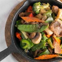 Sizzling Plate · Black pepper sauce, bell pepper, carrot, broccoli, mushroom and onion.