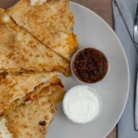 Southwest Quesadilla · Colby-jack cheese blend, onions, tomatoes, sour cream, salsa. Add chicken or taco beef for a...