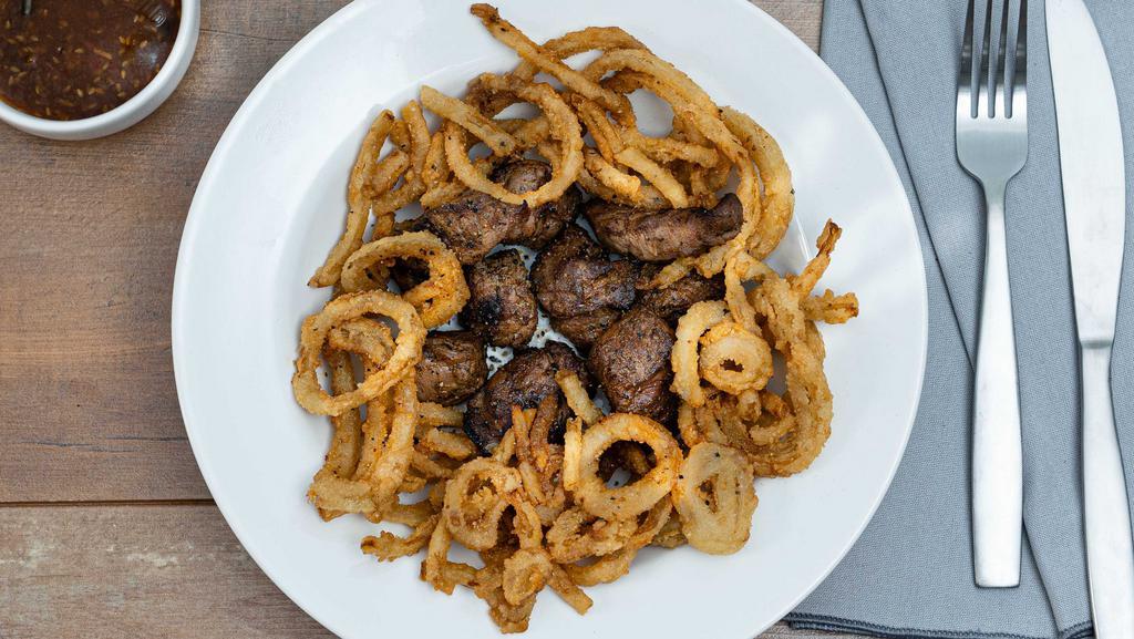 Tenderloin Tips · Tender, flavorful, aged tenderloin tip. Cowboy jack's dry rub, garnished with onion strings. Served with a side of chili garlic sauce. Under 550 calories.