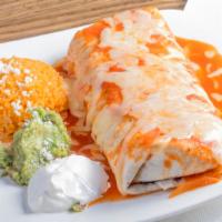Mojado · Grilled chicken or steak and black beans topped with melted cheese & salsa roja, served with...