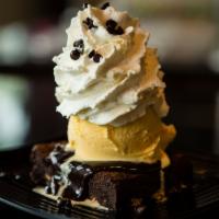 Triple Chocolate Brownie · Brownie, vanilla ice cream, chocolate sauce, whipped cream.