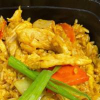 Yellow Curry Fried Rice · Stir fried rice with yellow curry powder, carrot, peapod, broccoli, and served with fresh gr...