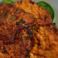 Tod Mun (4) · Marinated fish patties in red curry deep fried until perfect, served with cucumber salad and...