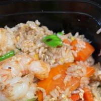 Simply Thai Fried Rice · Stir fried rice with carrot, peapod, onion, tomato, and egg. Topped with shredded onion.