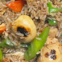 Tom Yum Fried Rice · Spicy. Stir fried rice in chilli paste, soybean with lemon juice and carrot, peapod, white, ...