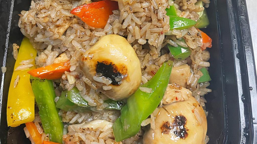 Tom Yum Fried Rice · Spicy. Stir fried rice in chilli paste, soybean with lemon juice and carrot, peapod, white, green onion.