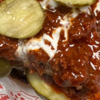 Nashville Chicken Sandwich · Fresh breaded chicken breast covered in Nashville hot sauce and finished with pickles, lettu...