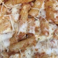 Baked Rigatoni · Imported Rigatoni pasta tossed in our house made marinara. Then baked with mozzarella and pa...