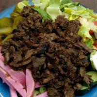 Beef Shawarma Bowl · Vertically roasted beef shawarma on a bed of either rice, lettuce, hummus, or fries served w...
