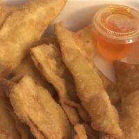 Fried Crab Rangoon (8 Pieces) · Top menu item. Deep-fried wonton stuffed with cream cheese and crab meat, served with plum s...