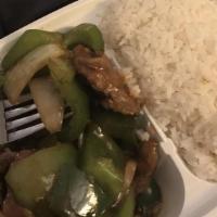 Pepper Steak · Spicy. Stir-fried beef slices in brown sauce with green bell pepper and white onion, served ...