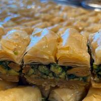 Baklava (Pistachio) · Layered  phyllo dough, a crisp flaky dough stuffed with an assortment of nuts topped with sy...