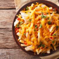 Pizza Fries · Golden fries covered with shredded cheese and marinara sauce.