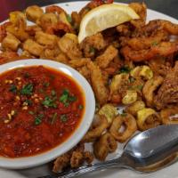 Fried Calamari · Served with bell peppers and pepperoncini. Includes a side of spicy marinara