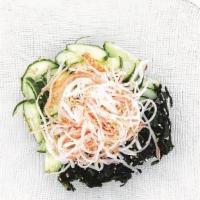 Sunomono · Sliced cucumber and seaweed with sunomono sauce.