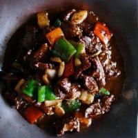 Pepper Steak · Marinated, Hand-Cut Flank Steak, Black Pepper Sauce, Bell Peppers, Onion, Thai Basil