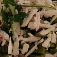 Ensalada De Nopales · Dairy, vegetarian. cactus salad with pickled peppers, red onion, radish, cilantro, fresh che...