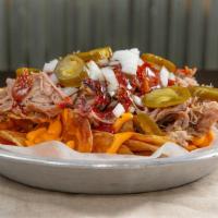 Loaded Bbq Chips · Comes with Pork or Chicken, sharp cheddar cheese sauce,as well as your choice of BBQ sauce: ...